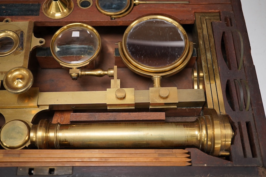 A mid 19th century folding compound and simple monocular microscope by William Harris & Co. 50 High Holborn, London, in its fitted mahogany case with paper maker’s label to inside of the lid. Condition - fair to good, so